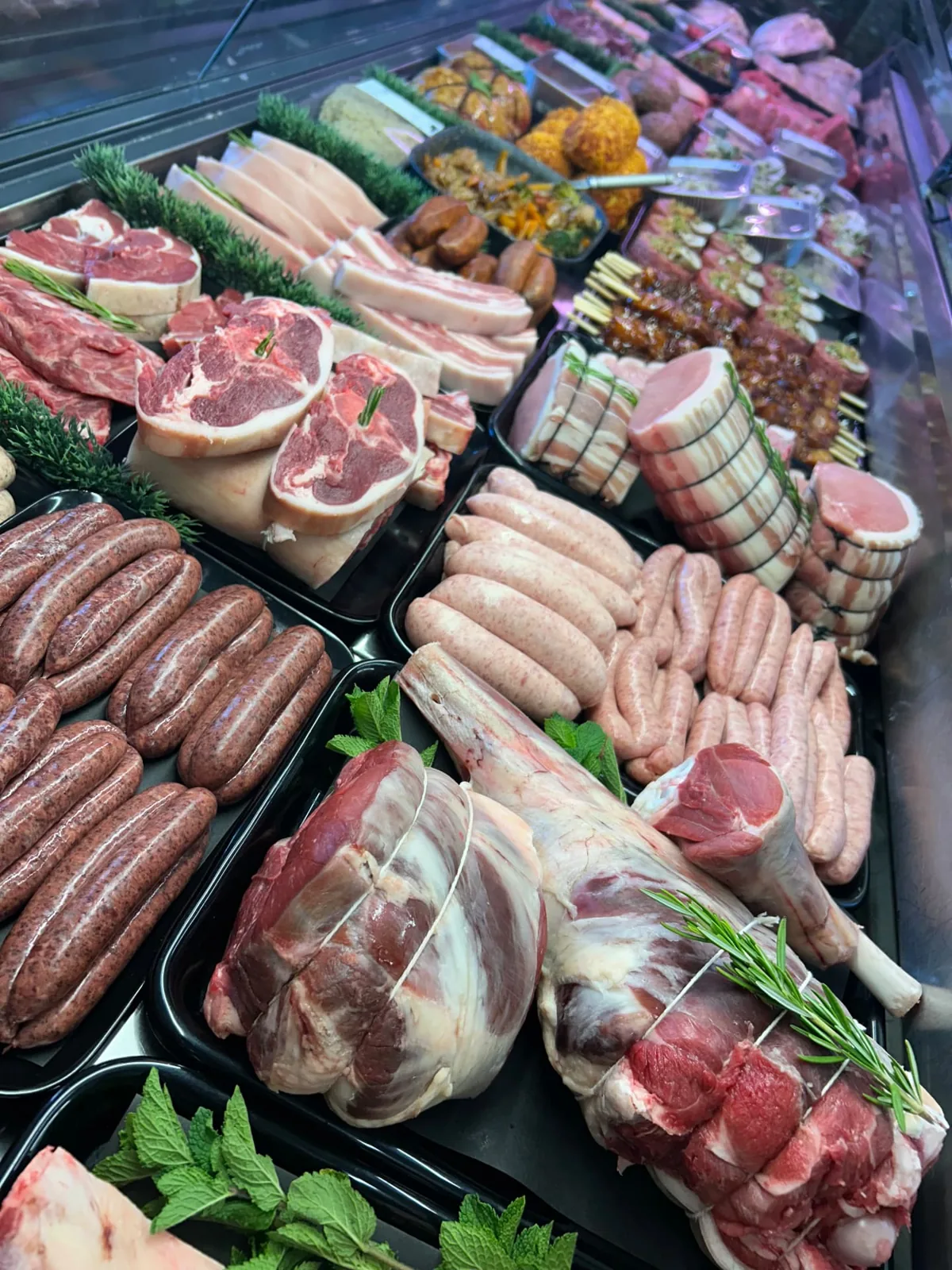 Fresh local meat cuts, sausages and prepared portions at a Sandbach butcher’s counter